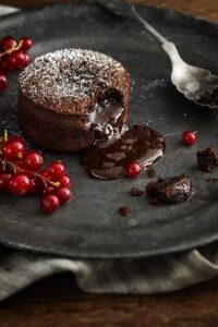 Warm,Chocolate,Lava,Cake,With,Bite,Taken,Out,Of,Molten