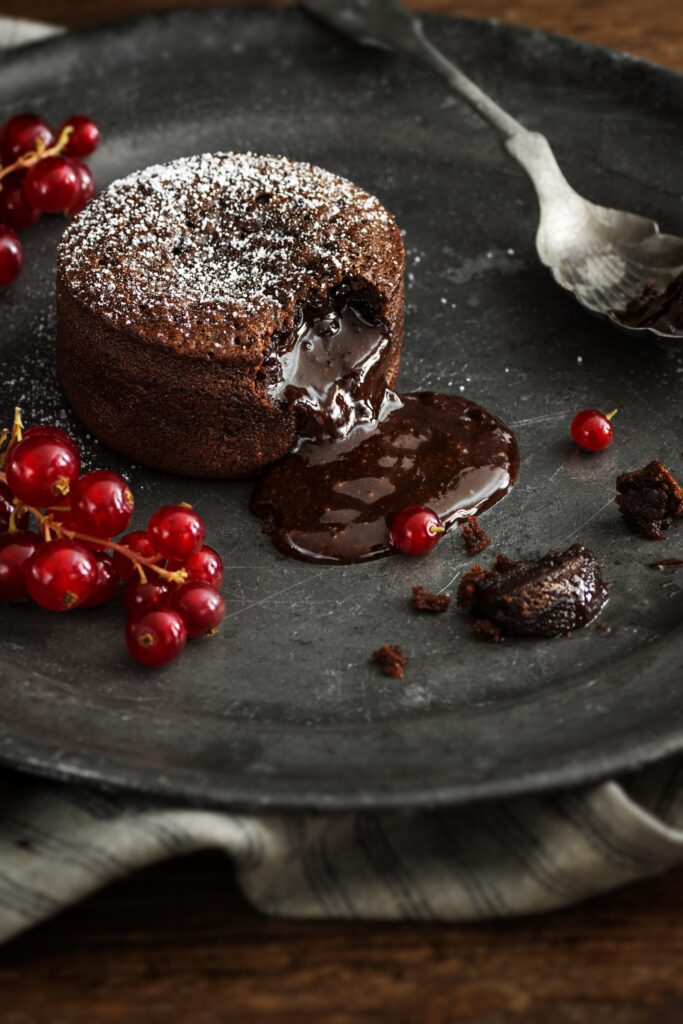 Warm,Chocolate,Lava,Cake,With,Bite,Taken,Out,Of,Molten